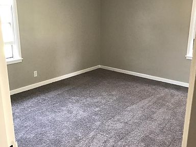 Bedroom with carpeting